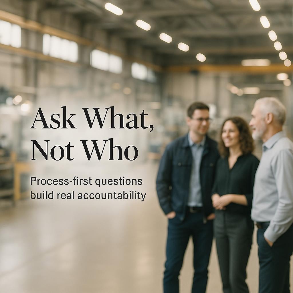 Minimal Gemba Walk leadership hero image with three professionals discussing process at a whiteboard on a softly lit shop floor, conveying Ask What Not Who and process first accountability.