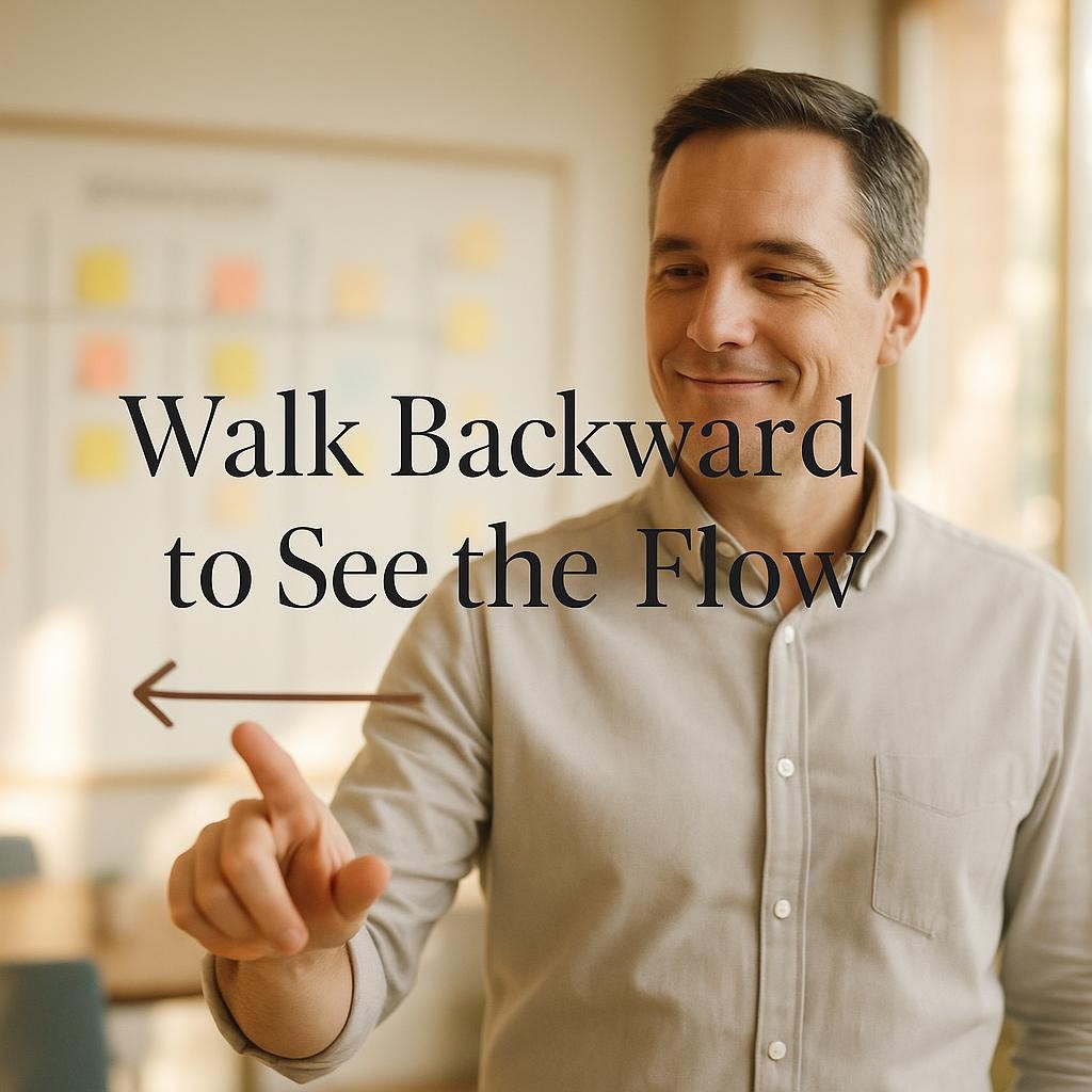 Business leader tracing a reverse workflow on a glass panel in a warm modern office with a blurred Kanban board, illustrating a backward Gemba Walk to reveal value stream flow, queues, pull signals, and collaboration.