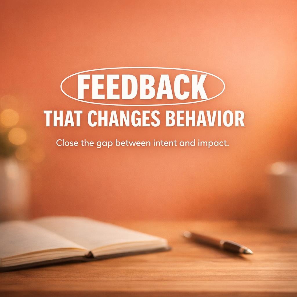 Reflective leadership blog hero image with warm terracotta background, blurred notebook and pen on a desk, and large white text reading Feedback That Changes Behavior with Feedback highlighted, plus a smaller line about closing the gap between intent and impact.